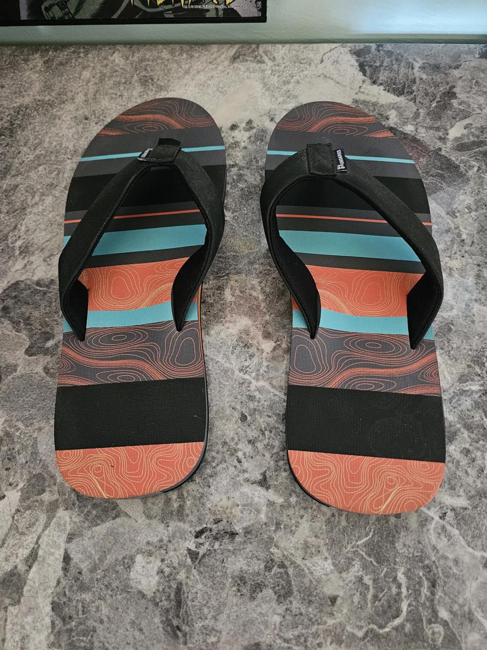 No Boundaries Men’s Black Flip-Flops with Orange and Teal Stripes